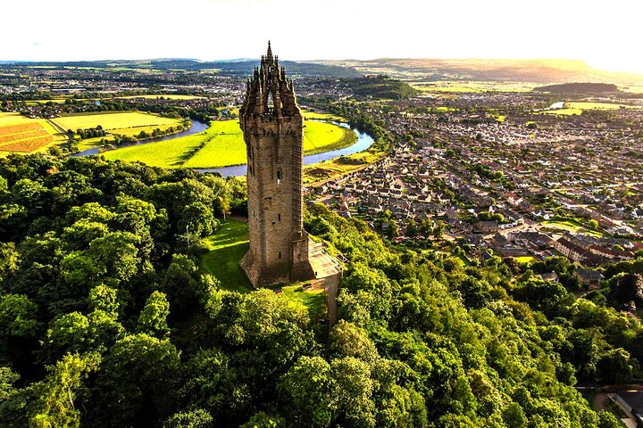 Explore the majestic William Wallace Monument surrounded by lush greenery and stunning landscapes offering a glimpse into Scotland's rich heritage and breathtaking scenery. A perfect stop for history lovers!